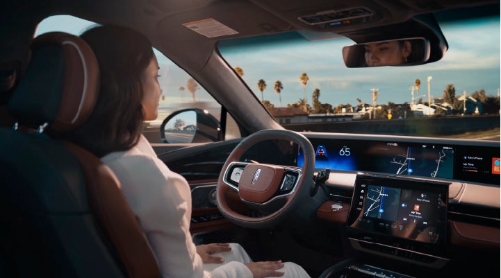 A person is shown driving hands-free on the highway with available Lincoln BlueCruise technology. | Performance Lincoln Bountiful in Bountiful UT