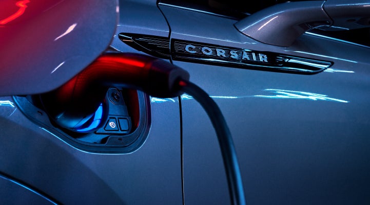A charger plugged into the charging port of a 2024 Lincoln Corsair® Plug-in Hybrid model. | Performance Lincoln Bountiful in Bountiful UT